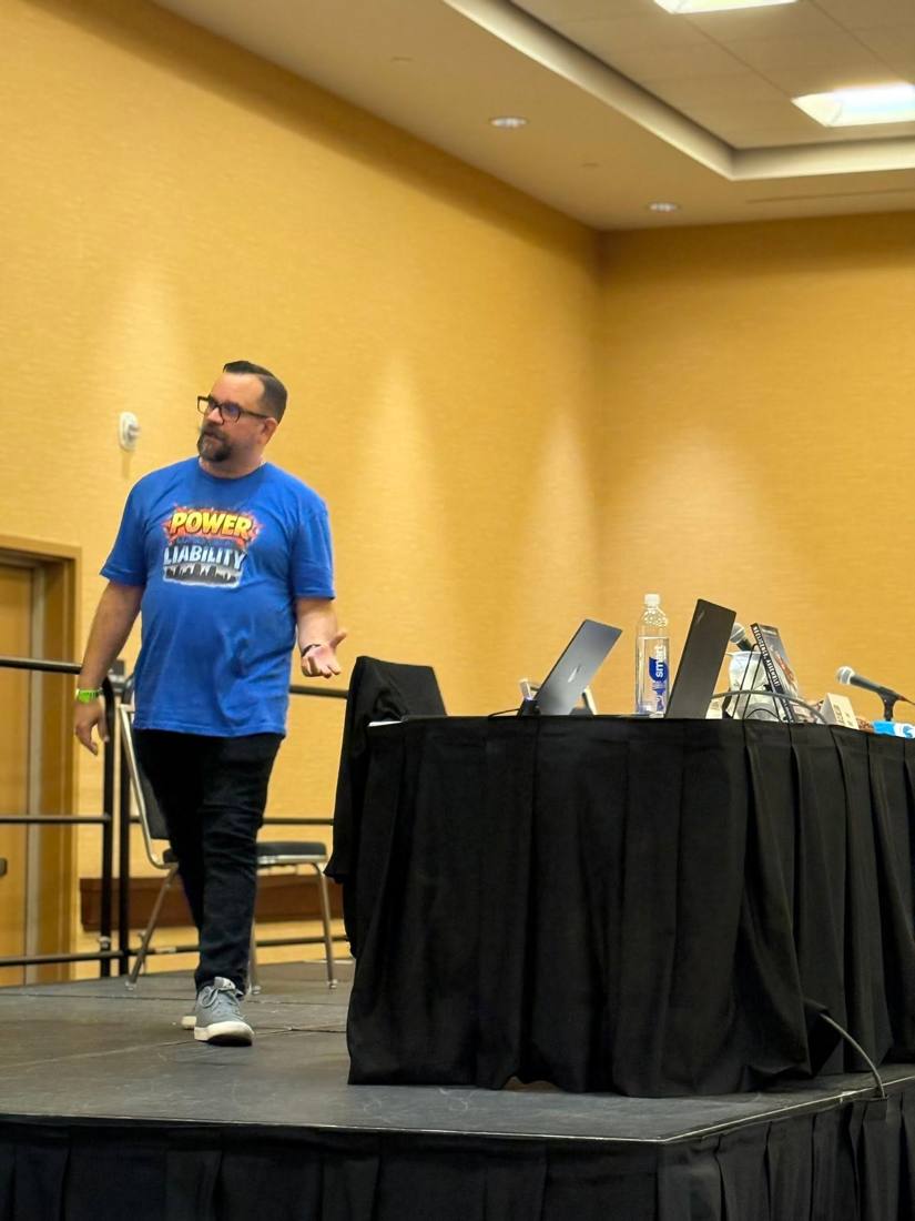 Brian presenting on stage